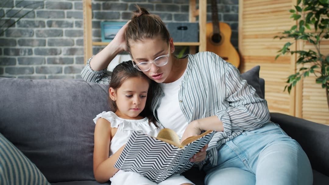 Caregiver reading with child at home